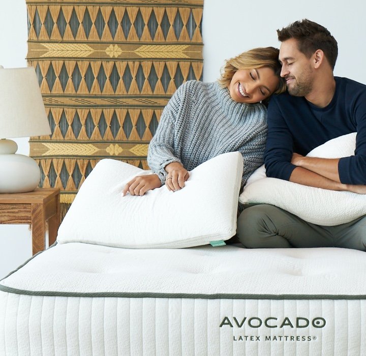 happy couple on avocado latex mattress